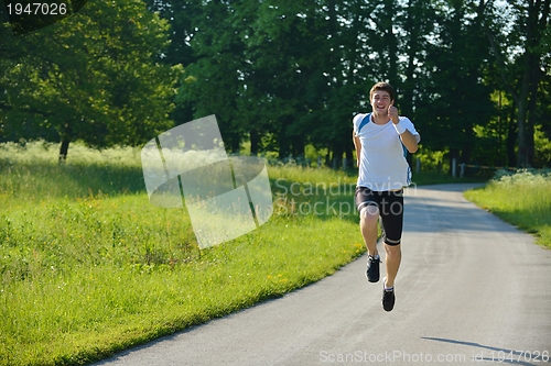 Image of Young couple jogging at morning