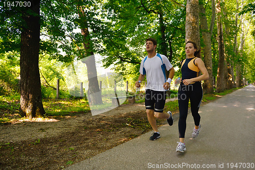 Image of Young couple jogging