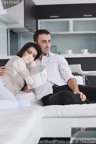Image of happy young couple relax at home
