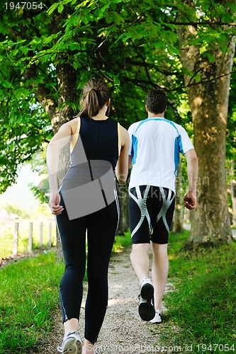 Image of Young couple jogging