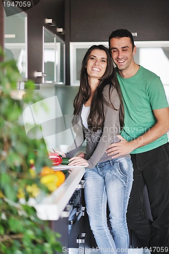 Image of young couple have fun in modern kitchen