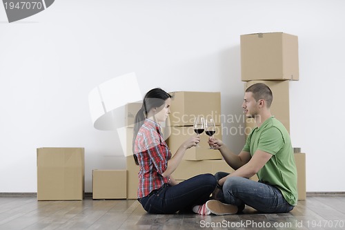 Image of Young couple moving in new home