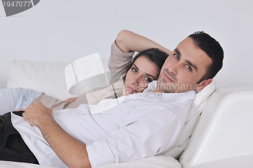 Image of happy young couple relax at home