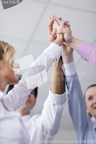 Image of business people group joining hands
