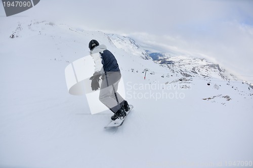 Image of skiing on fresh snow at winter season at beautiful sunny day