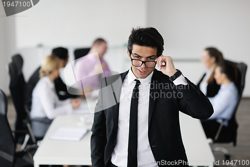 Image of young business man at meeting