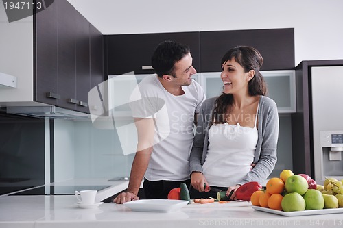 Image of young couple have fun in modern kitchen