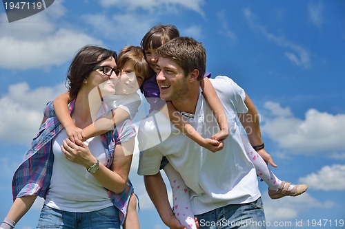 Image of happy young family have fun outdoors