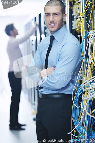 Image of it enineers in network server room
