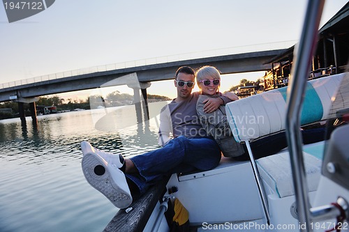 Image of portrait of happy young man on boat