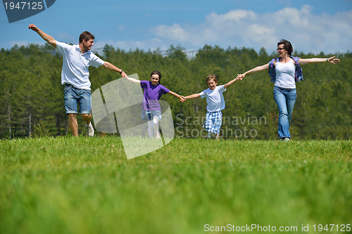 Image of happy young family have fun outdoors