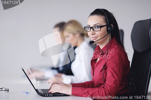 Image of business woman group with headphones