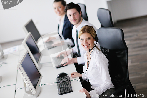 Image of business people group working in customer and help desk office