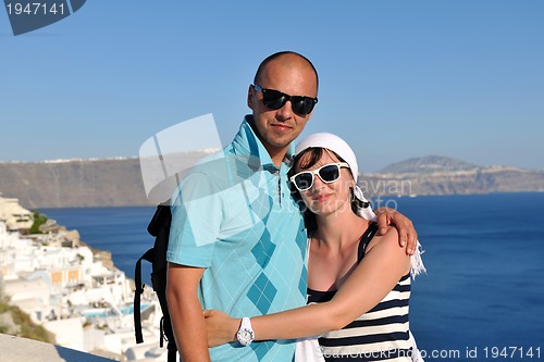 Image of happy young couple tourists in greece