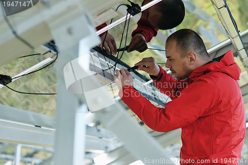 Image of Male solar panel engineer at work place