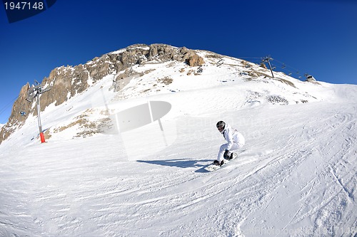 Image of skiing on fresh snow at winter season at beautiful sunny day