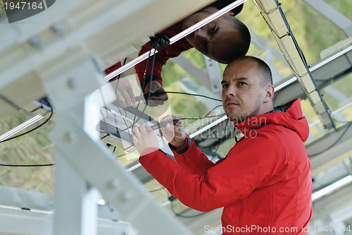 Image of Male solar panel engineer at work place
