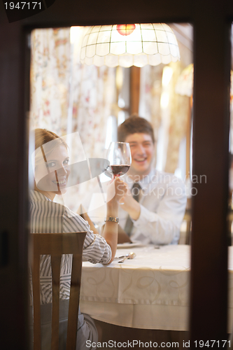 Image of young couple having dinner at a restaurant