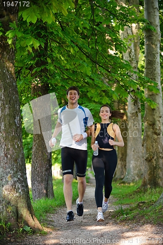 Image of Young couple jogging