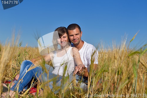 Image of happy couple in wheat field