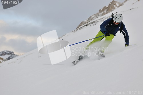 Image of skiing on fresh snow at winter season at beautiful sunny day