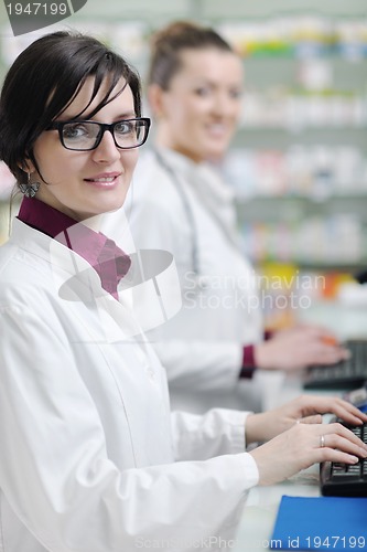 Image of team of pharmacist chemist woman  in pharmacy drugstore