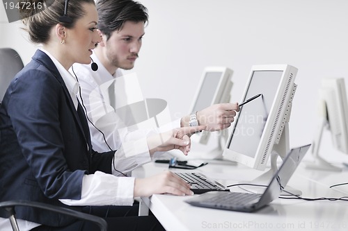 Image of business people group working in customer and help desk office