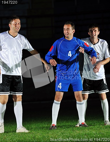 Image of football players in action for the ball