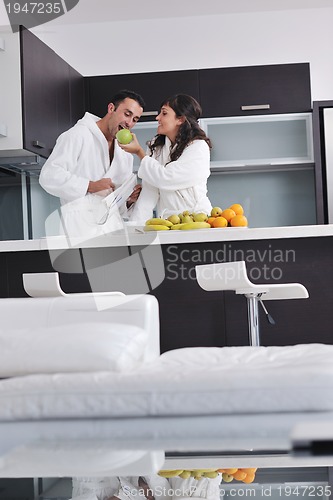 Image of young couple have fun in modern kitchen