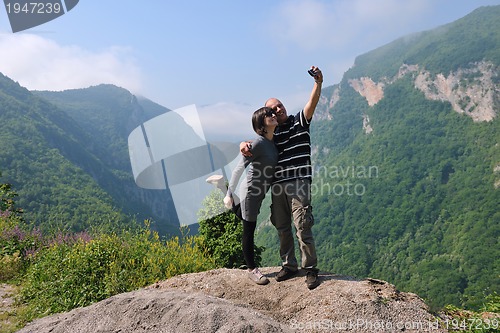 Image of happy young couple jumping in the air