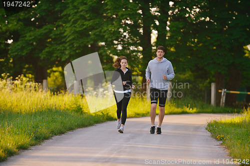 Image of Young couple jogging