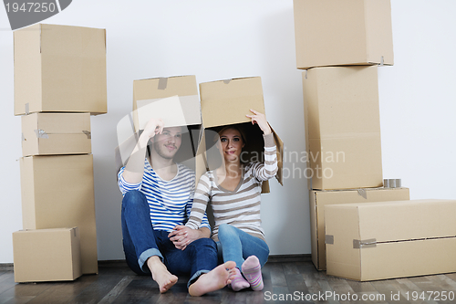 Image of Young couple moving in new house