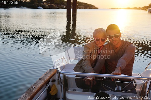 Image of couple in love  have romantic time on boat