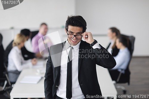 Image of young business man at meeting