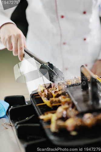 Image of chef preparing meal