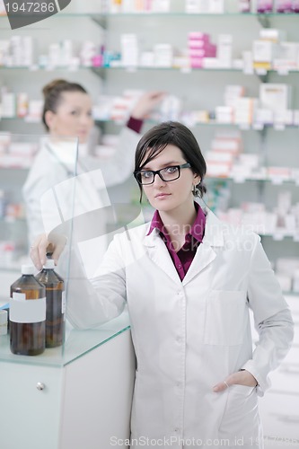 Image of team of pharmacist chemist woman  in pharmacy drugstore