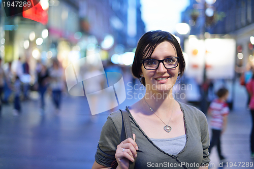 Image of woman portrait at night in city