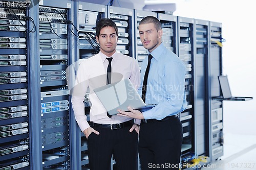 Image of it enineers in network server room