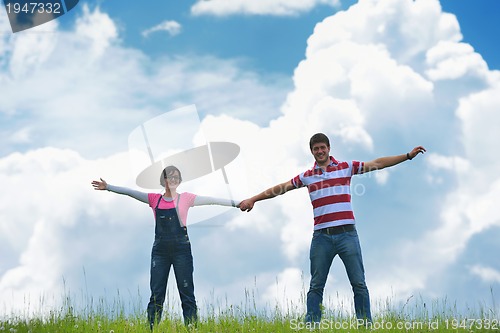 Image of romantic young couple in love together outdoor