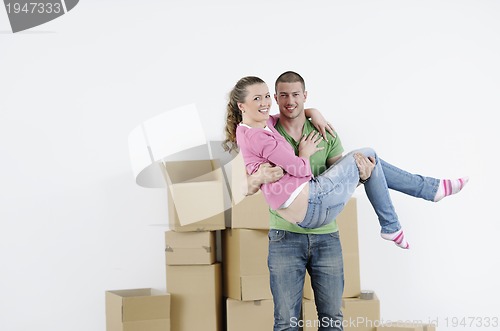 Image of Young couple moving in new home