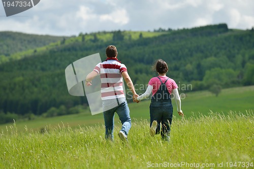Image of romantic young couple in love together outdoor