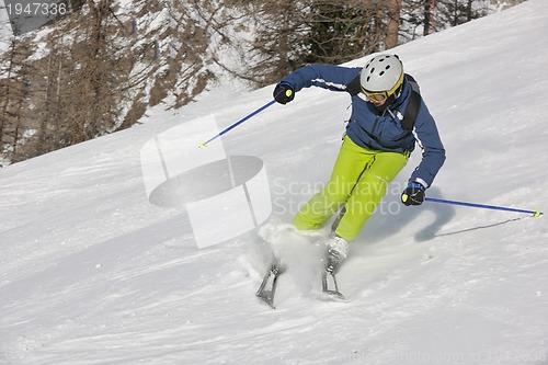 Image of skiing on fresh snow at winter season at beautiful sunny day