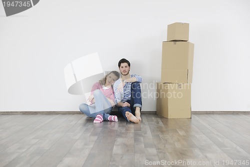 Image of Young couple moving in new home