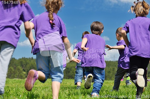 Image of happy kids group  have fun in nature