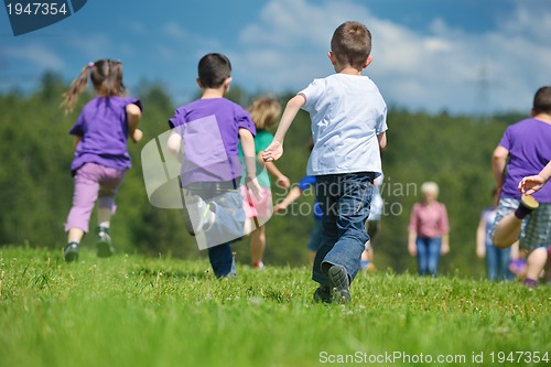 Image of happy kids group  have fun in nature