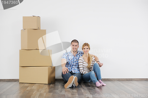 Image of Young couple moving in new home