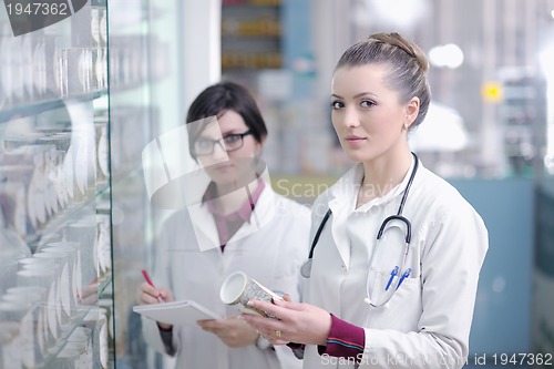 Image of team of pharmacist chemist woman  in pharmacy drugstore