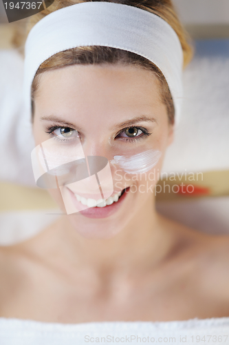 Image of Beautiful young woman in spa