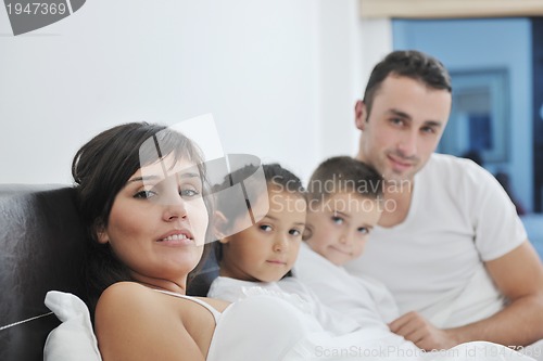 Image of happy young Family in their bedroom