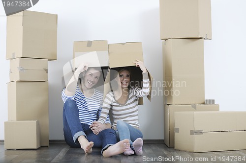 Image of Young couple moving in new home